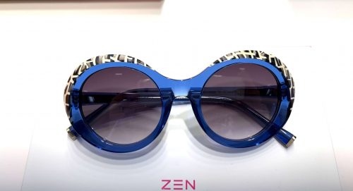 Blaue Sonnenbrille mit zebrafarbenem oberen Rand von Zen